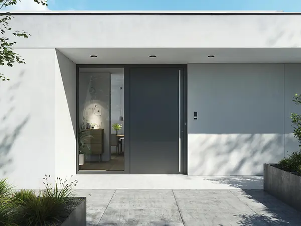 Porta d’ingresso Schüco in alluminio con maniglia a tirare e design essenziale