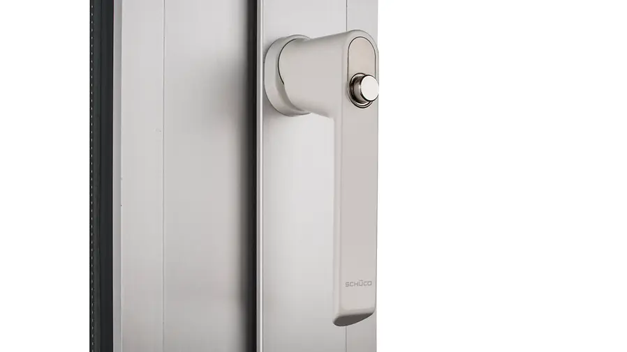Maniglia Schüco con pulsante integrato per maggiore sicurezza