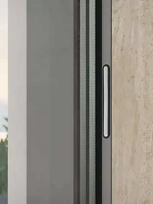 Dettaglio del sistema di movimentazione Schüco integrato nel profilo del serramento per apertura fluida