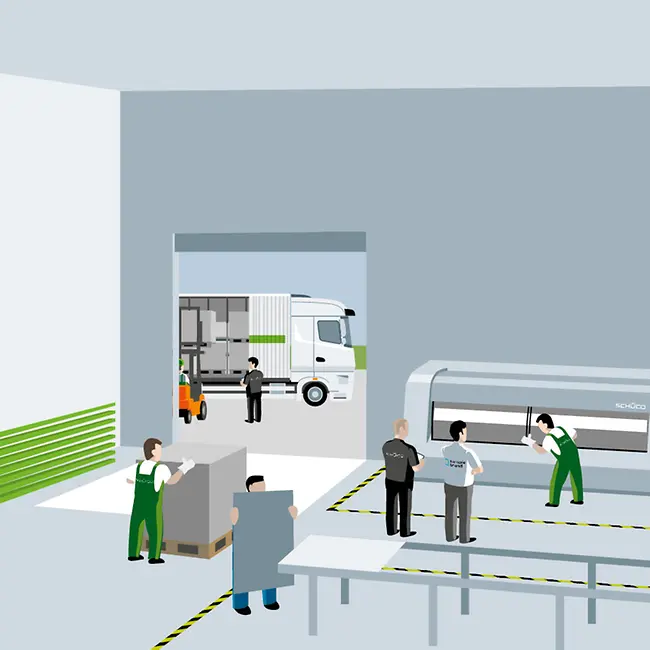 Tecnici Schüco e operatori osservano i macchinari in funzione all’interno di un’officina