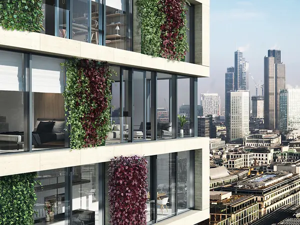 Edificio con facciata verde e struttura in alluminio a ridotte emissioni di CO₂, esempio di soluzione ibrida sostenibile.